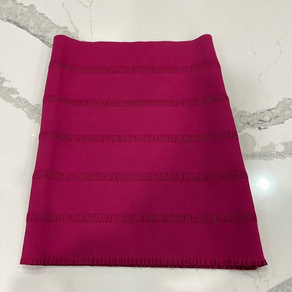 Fuchsia pink pencil skirt. Tag says “one size fits all”, but would fit a size S